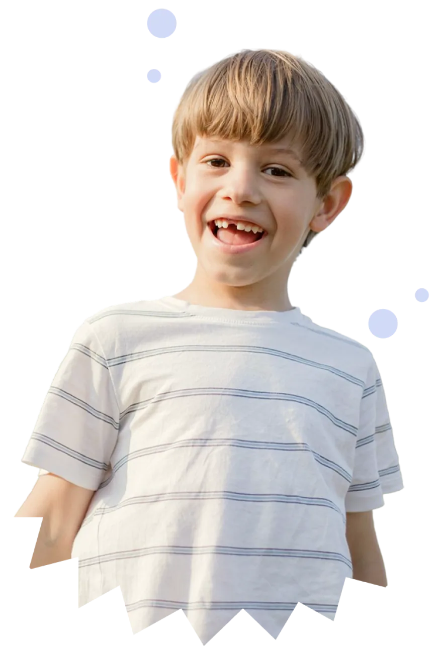 A boy laughing while he plays